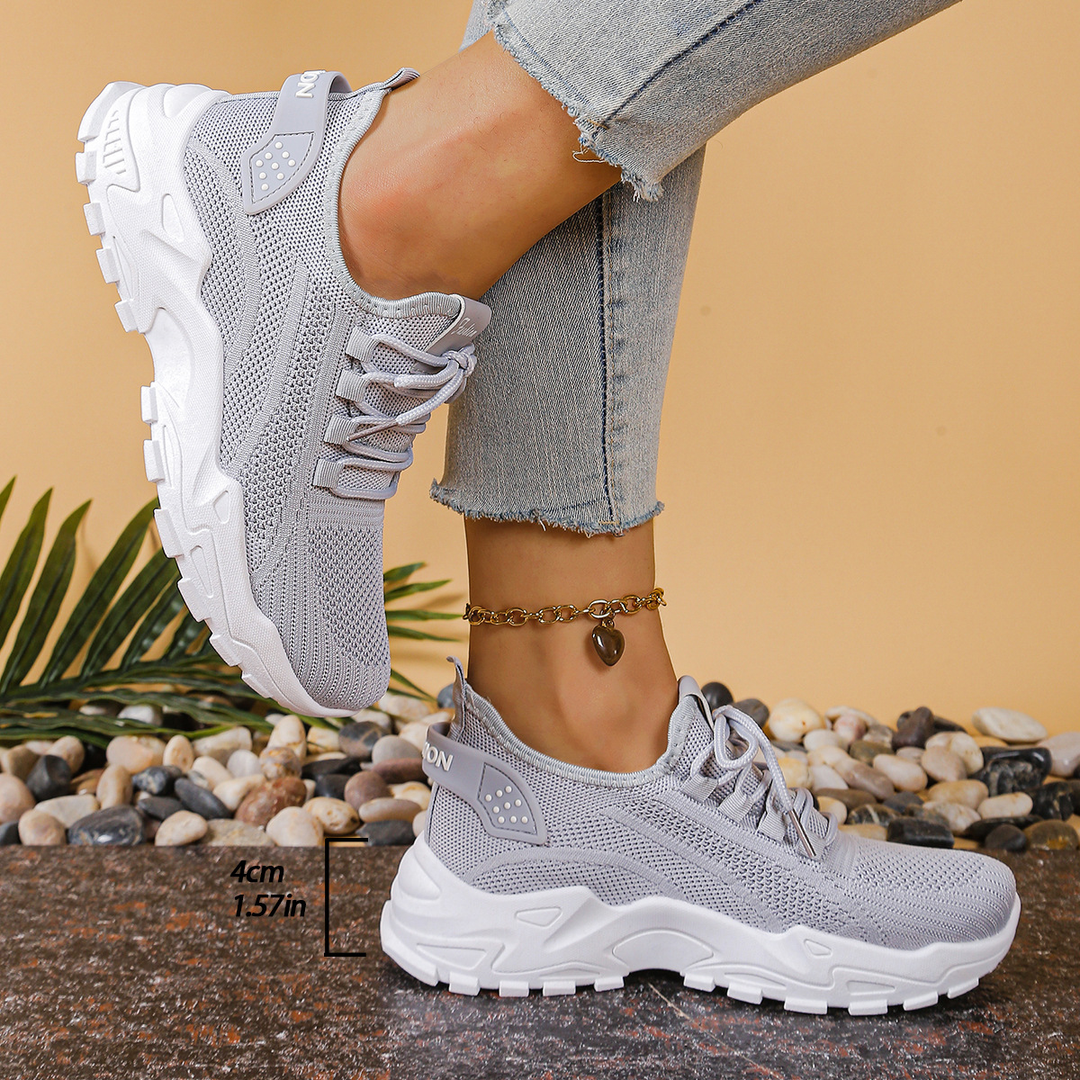 Women's orthopedic lace-up sneakers for active walking, providing breathable comfort and reliable support.