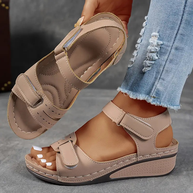Orthopedic women's sandals with a comfortable wedge heel, ideal for arch support & pain relief.