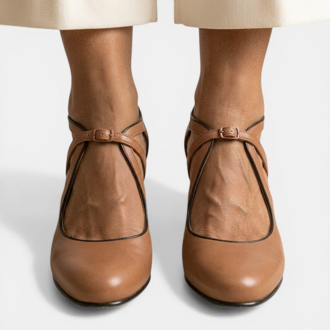 Brown T-Strap High Heel Sandals for women, featuring a round toe, buckle closure, & adjustable fit. Dress shoes.