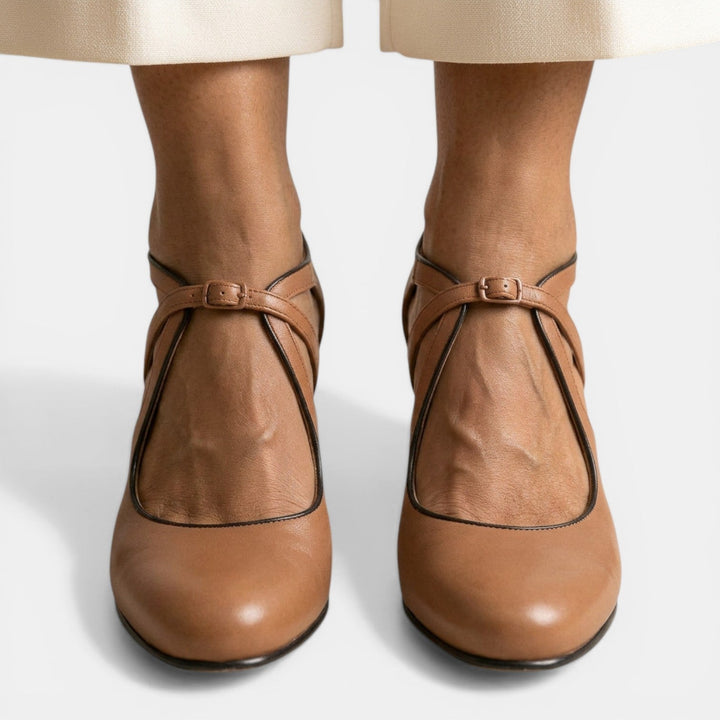 Brown T-Strap High Heel Sandals for women, featuring a round toe, buckle closure, & adjustable fit. Dress shoes.