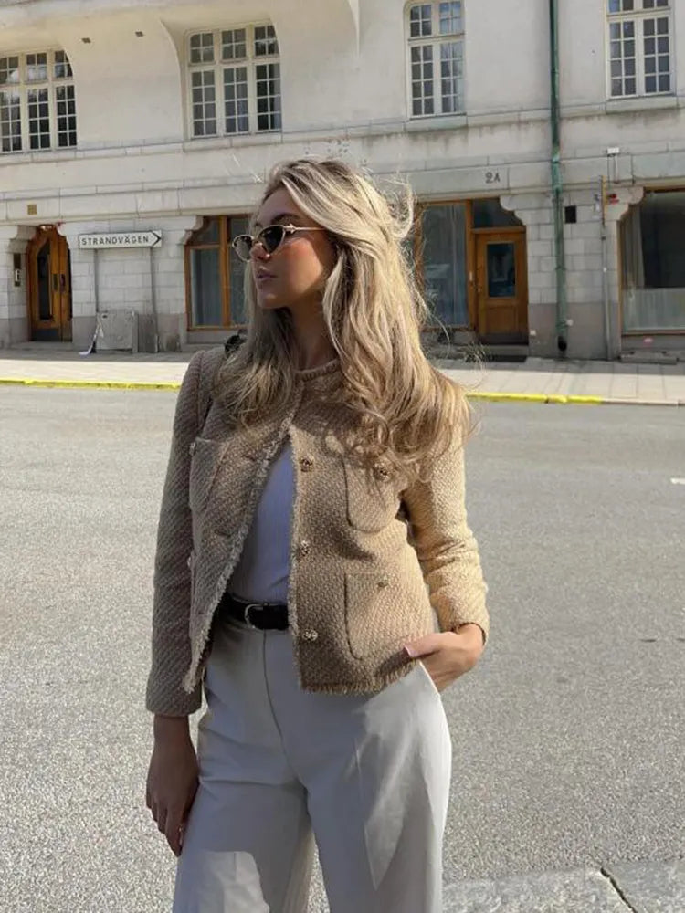 Stylish women's fringed cropped jacket, tailored fit, perfect elegant outerwear for autumn/winter fashion.
