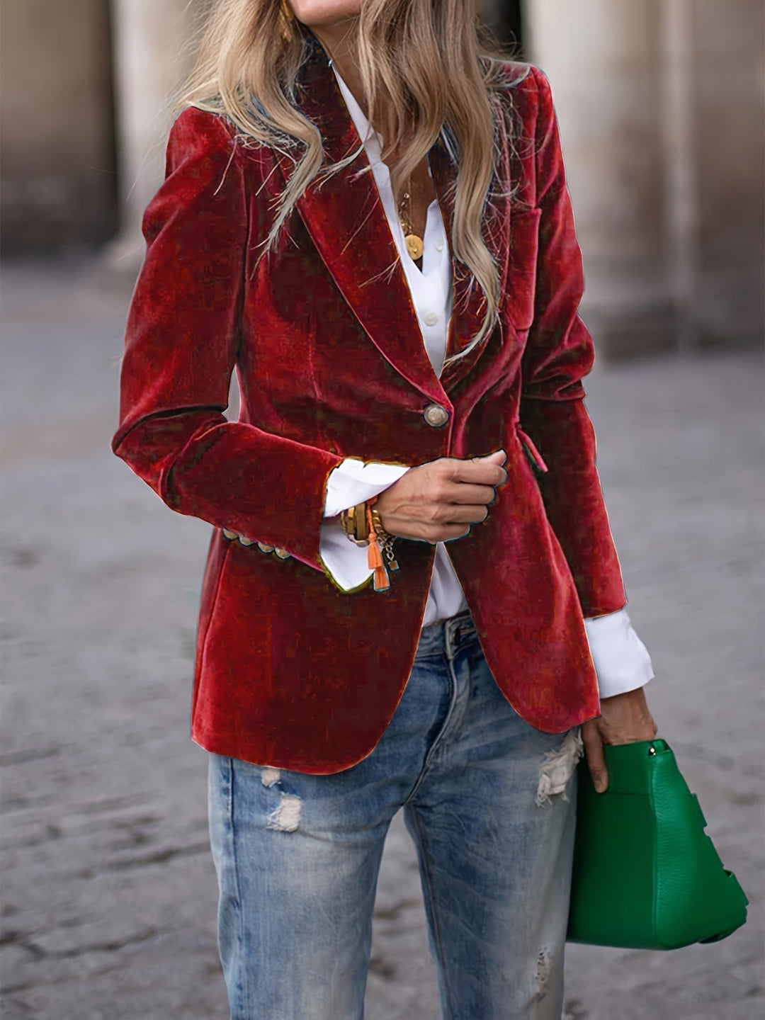 Women's tailored velvet blazer with elegant gold buttons, perfect for a sophisticated look.