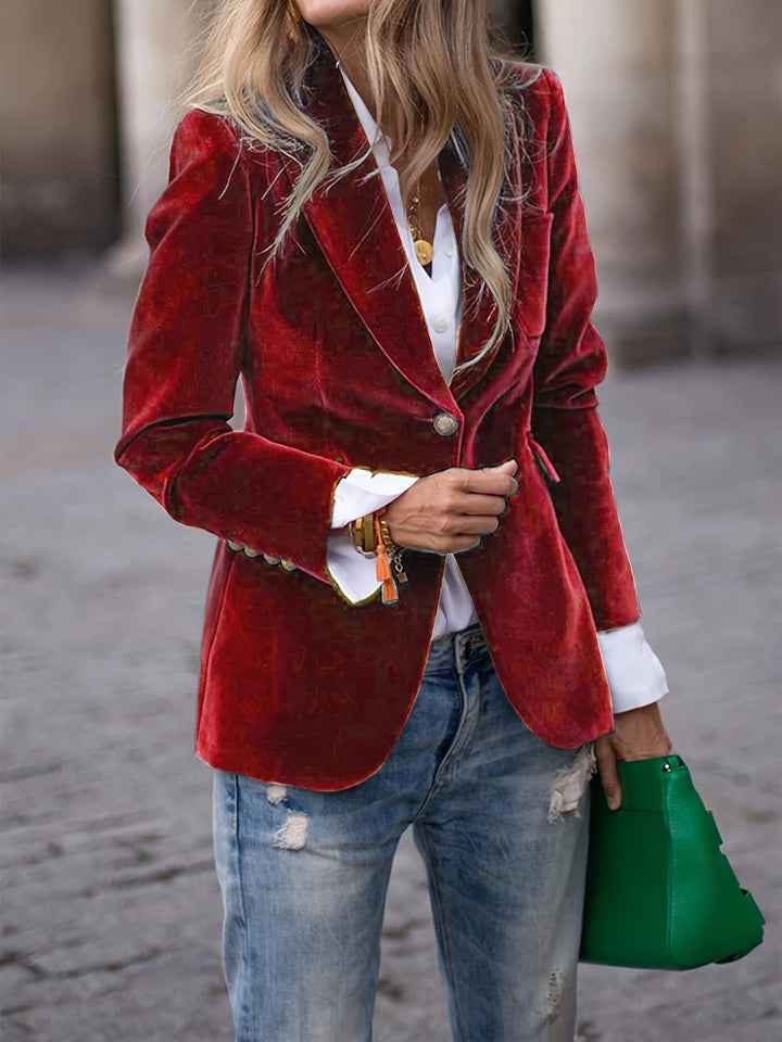 Women's tailored velvet blazer with elegant gold buttons, perfect for a sophisticated look.