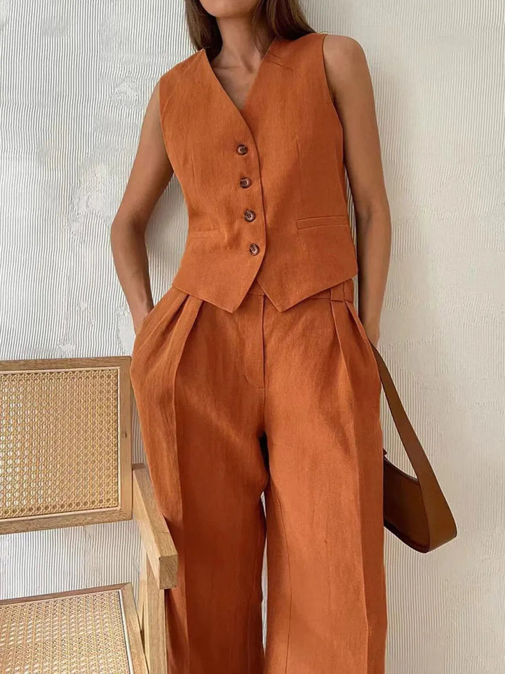 Chic women's tailored waistcoat and wide-leg trousers, a fashionable matching set for elegant wear.