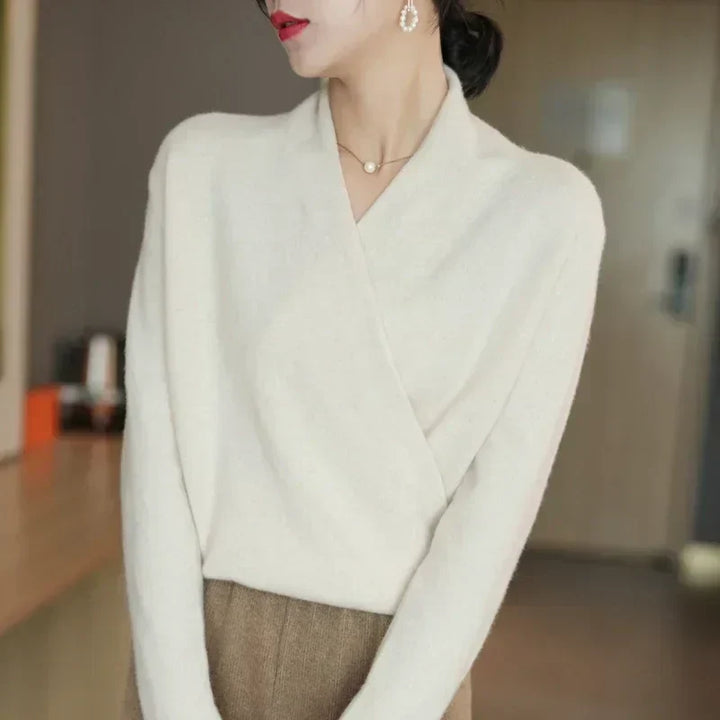 Women's teal knit wrap neck top, long sleeve, showcasing spring fashion and casual comfort.