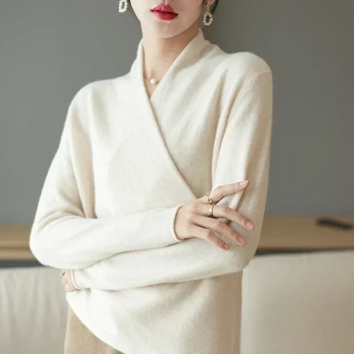 Close-up of the knit fabric on a women's wrap neck top, highlighting its lightweight texture.