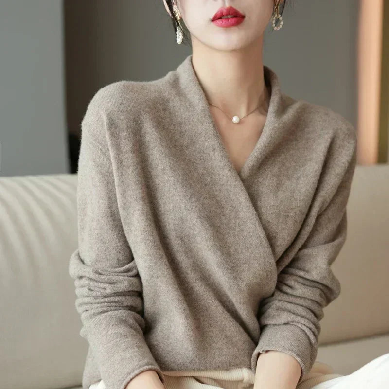 Pairing a women's knit wrap neck top with jeans, demonstrating a chic casual spring outfit.