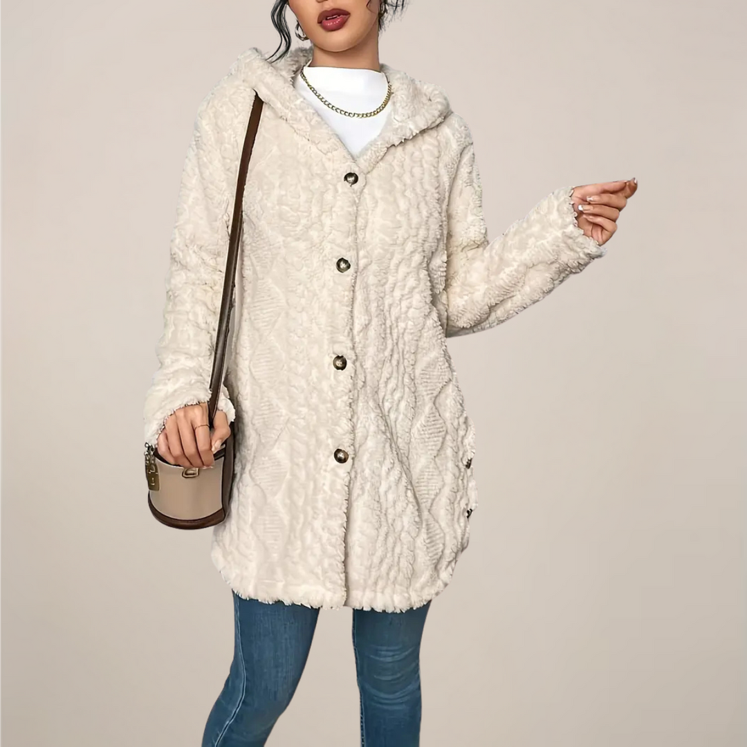 Stylish women's knitwear cardigan with a hood, longline cut, and intricate textured detailing.
