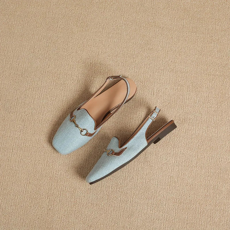 Women's textured slingback loafers in a neutral tone, essential footwear for any wardrobe.