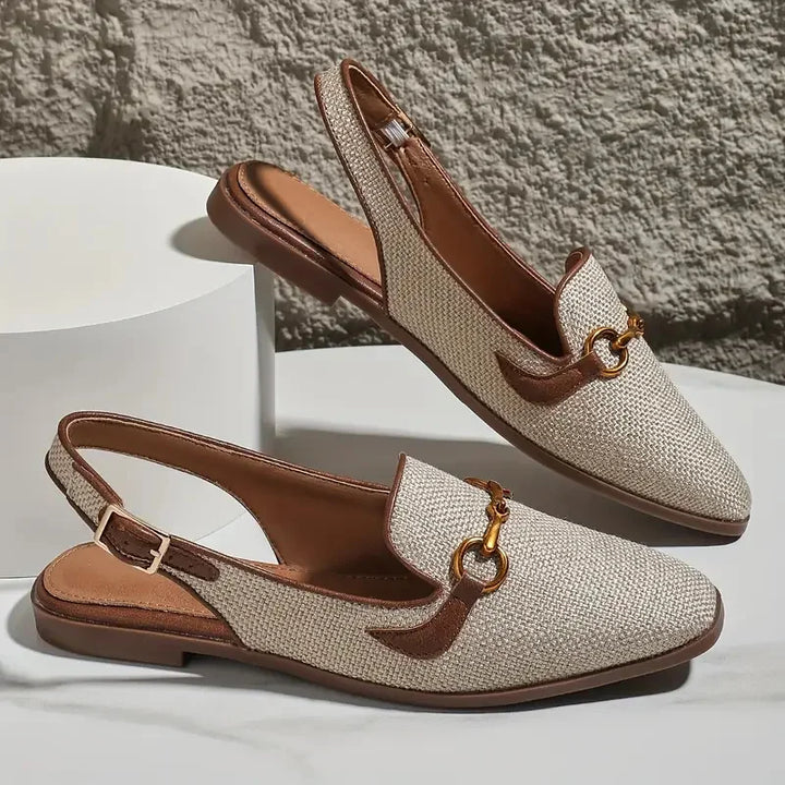 Model wearing women's textured slingback loafer flats, demonstrating their stylish fit.