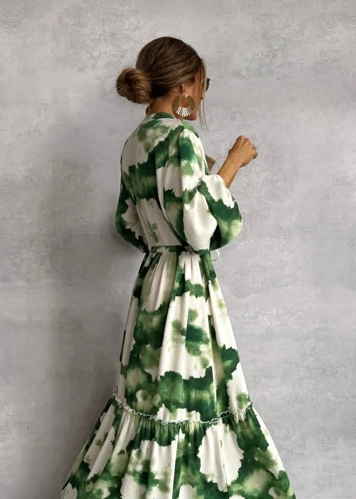 Women's tie-dye long sleeve tiered maxi dress with belt. Bohemian flowy green summer fashion.
