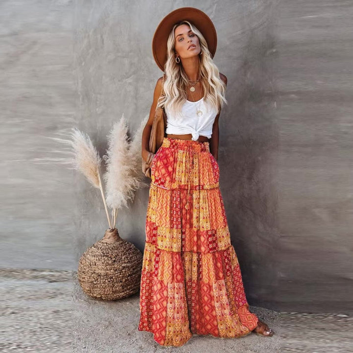 Women's tiered floral maxi skirt, high elastic waist. Flowy bohemian summer skirt with elegant print.