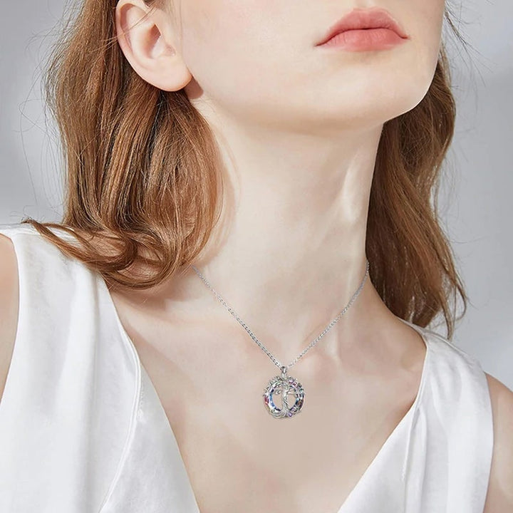 Women's Tree of Life pendant necklace with clear crystal accents on a delicate chain, an ideal spiritual gift.