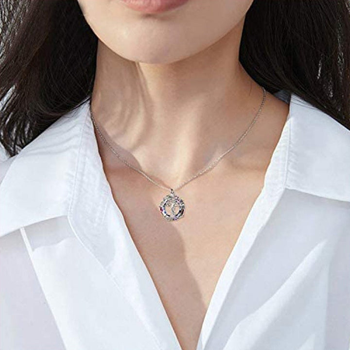 Detailed Tree of Life circular pendant for women, featuring intricate branches and clear crystals, perfect jewelry.