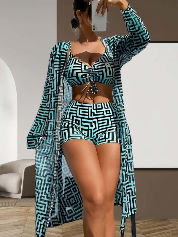 Trendy women's bikini set featuring high-waisted shorts, a matching top, and a lightweight sheer cover-up.