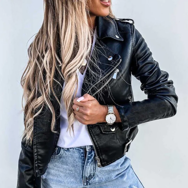 Women's trendy black zip-up biker jacket with silver hardware, full view.