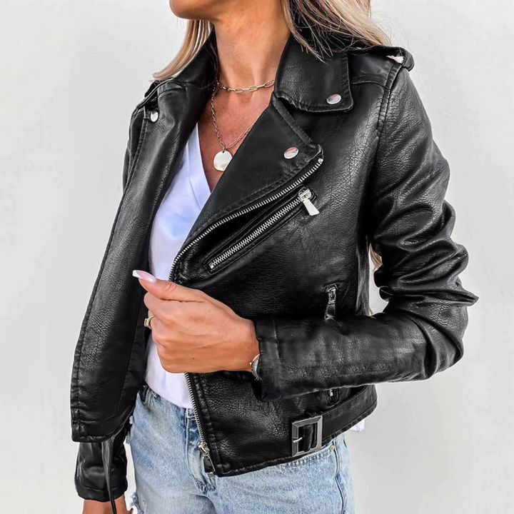 Fashionable red zip-up biker jacket for women, close-up of zipper and collar details.