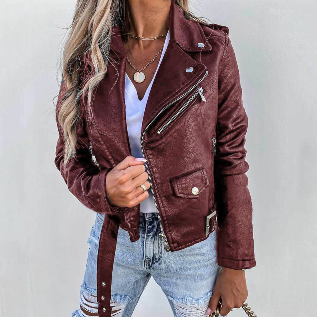 Detail of a women's black biker jacket, focusing on the zip-up front and sleeve cuffs.