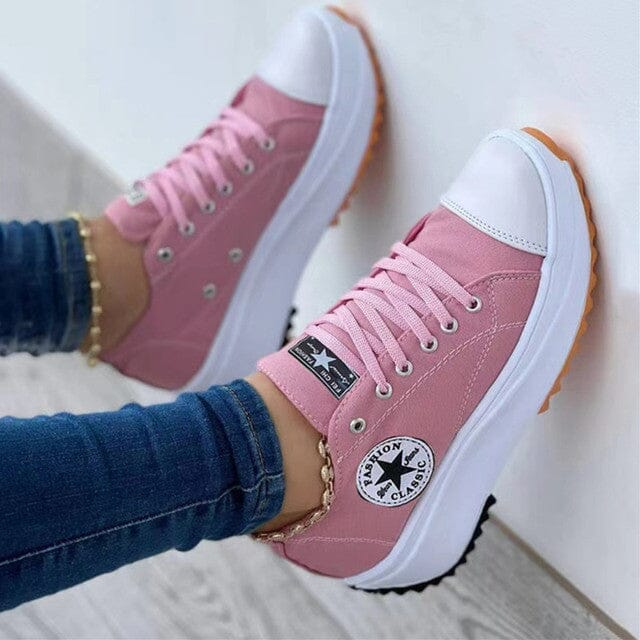 Stylish women's platform sneakers with a bold chunky sole, ideal for a fashionable casual look & street style.