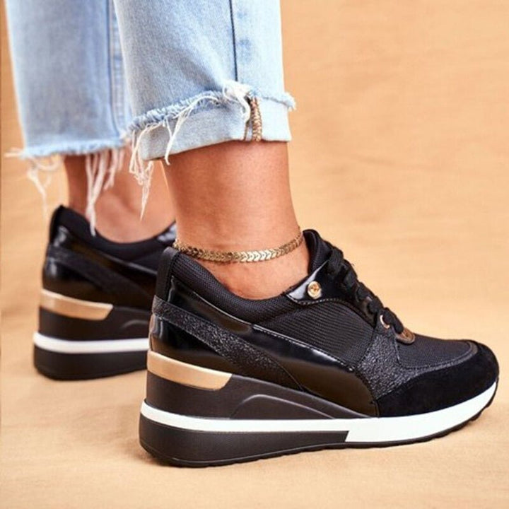 Women wearing trendy gold & black non-slip fashion sneakers, perfect for active casual wear