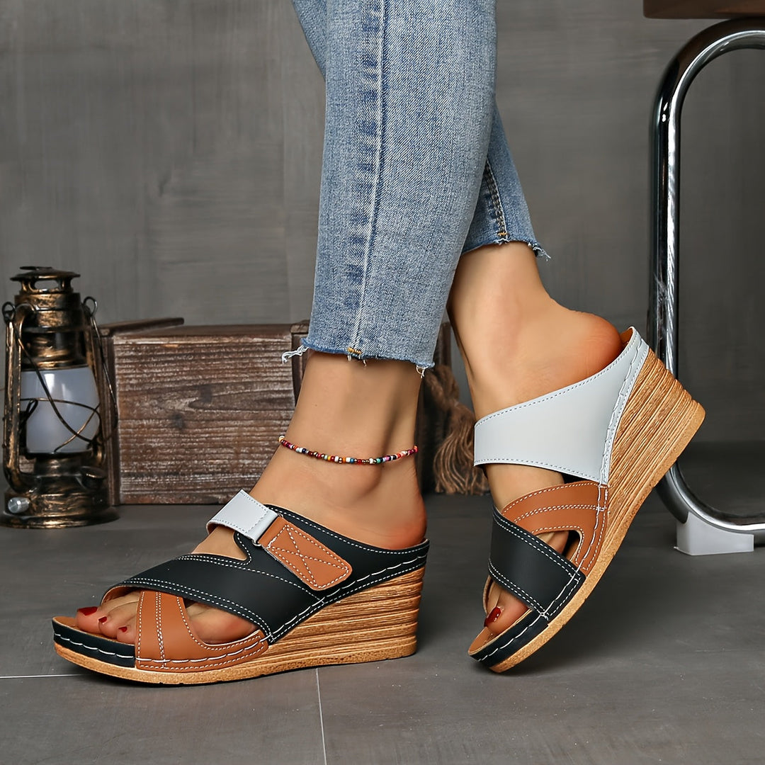 Comfortable slip-on wedge sandals for women, featuring a chic two-tone design, ideal for summer and casual wear.