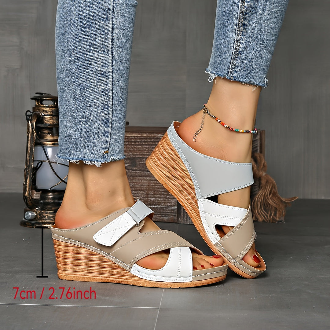 Women's open-toe wedge slides, offering a fashionable two-tone look. Perfect summer shoes for stylish comfort.