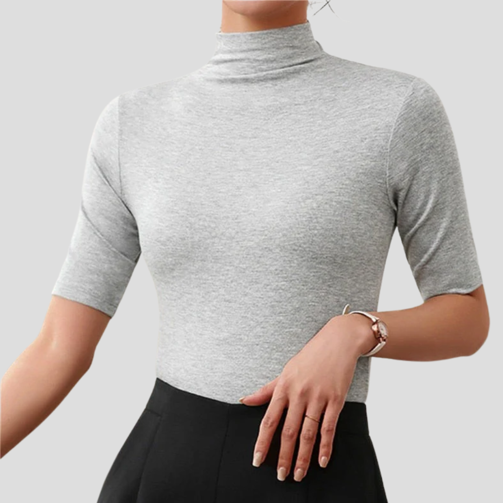 Seamless women's ultra-thin turtleneck, a versatile long-sleeve layering shirt. Smooth slim-fit everyday apparel.