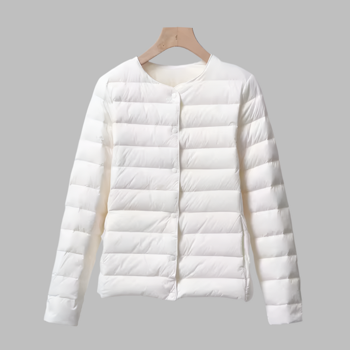 Packable women's ultralight puffer jacket, collarless design for easy layering & travel. Spring/winter outerwear.