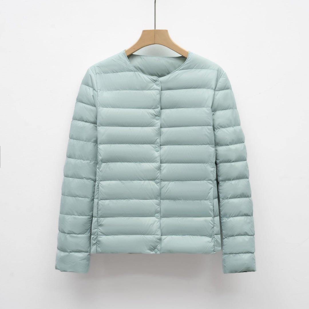 Women's ultralight collarless puffer jacket. A portable, warm outerwear piece for casual winter & spring style.