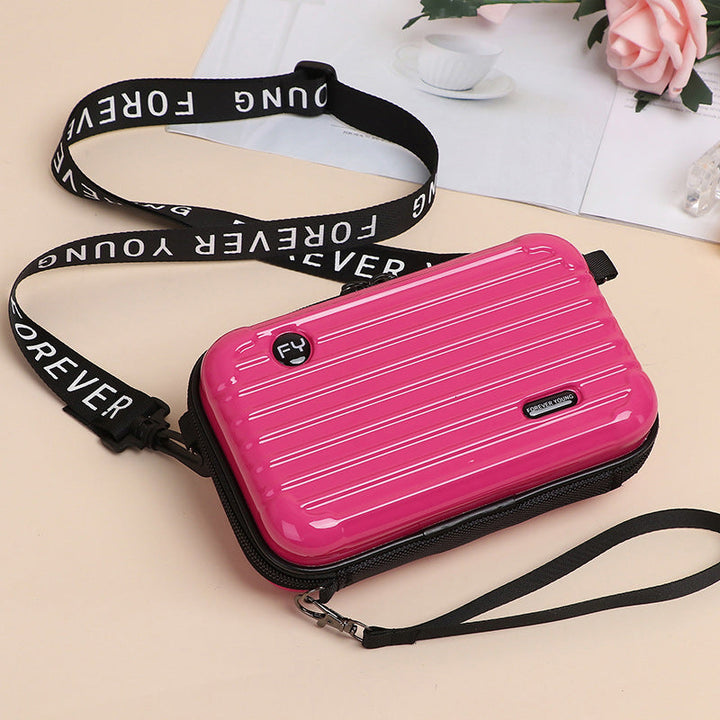 Open view of a Women's unique mini suitcase crossbody bag revealing interior space