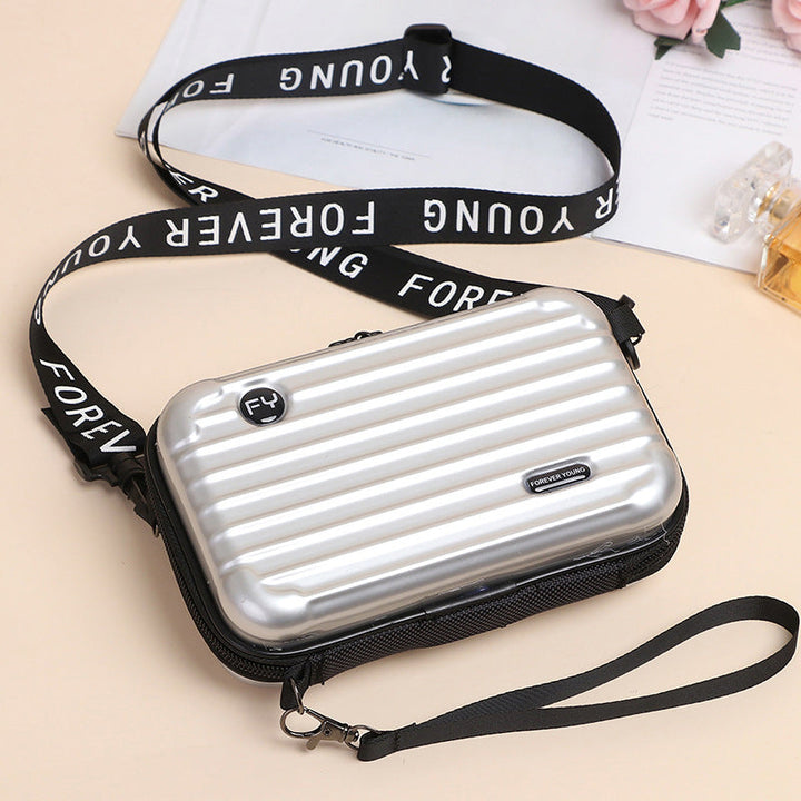Women's mini suitcase crossbody bag featuring a durable PVC construction