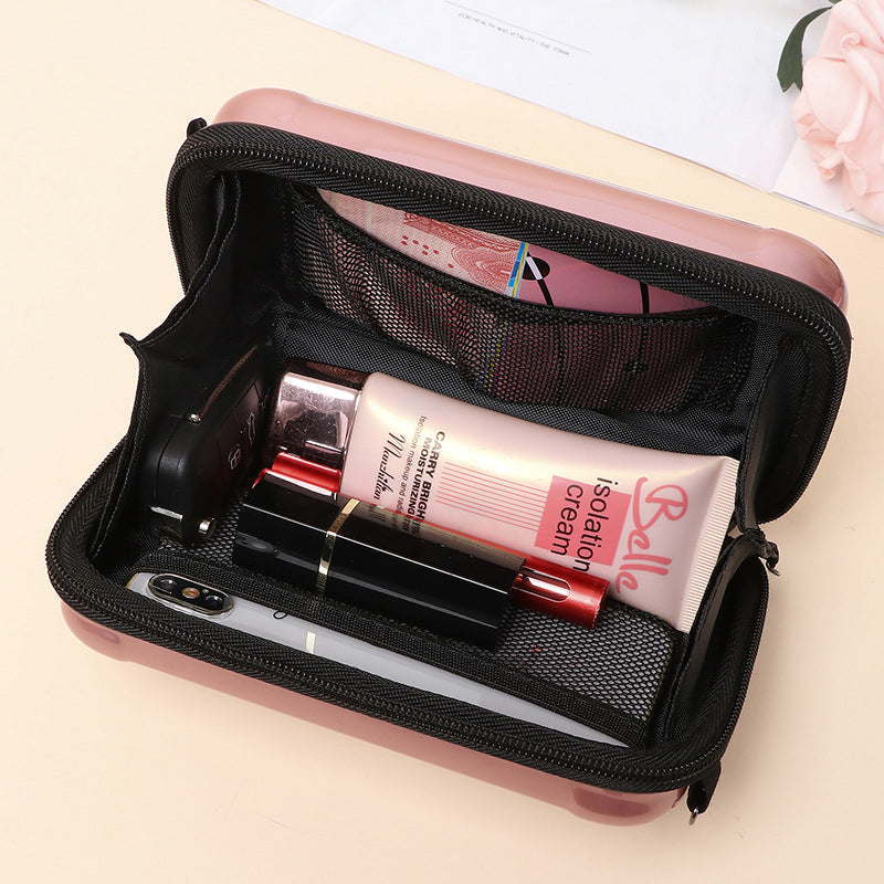 Front view of a Women's mini suitcase crossbody bag with detailed hardware