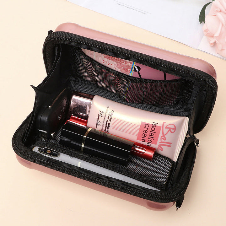 Front view of a Women's mini suitcase crossbody bag with detailed hardware