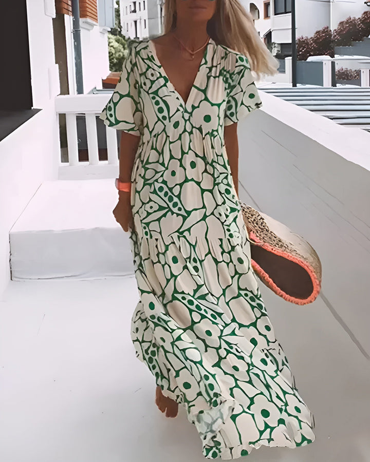 Women's V-neck abstract print maxi dress, perfect for stylish summer wear & vacation outfits.