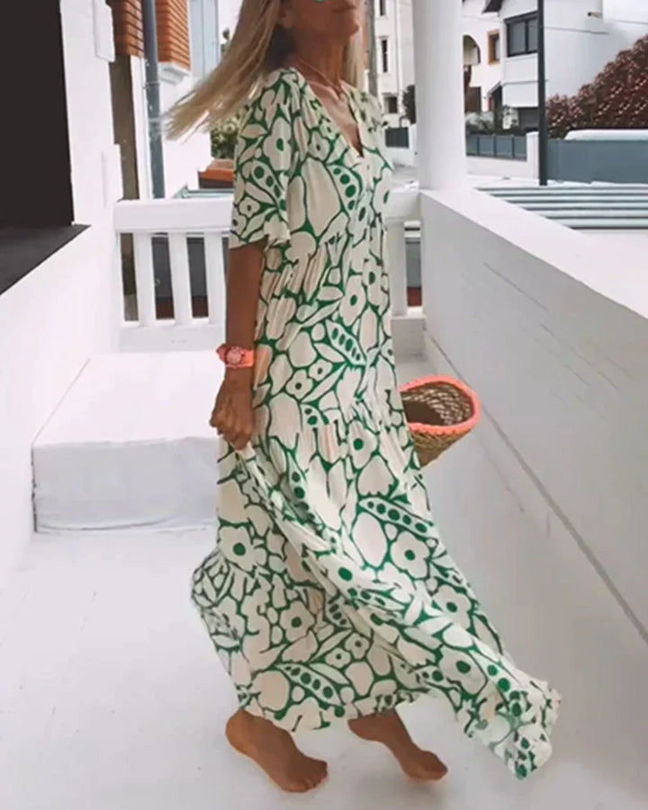Elegant women's summer maxi dress with a flattering V-neckline and eye-catching abstract pattern.