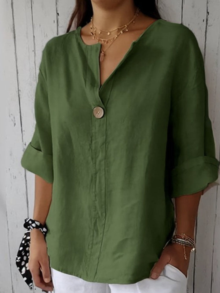 Elegant women's V-neck button-down blouse featuring adjustable roll tab long sleeves, suitable for office & casual.
