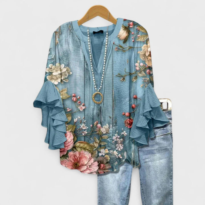 Chic V-neck top with delicate ruffle sleeves, a versatile women's fashion blouse.