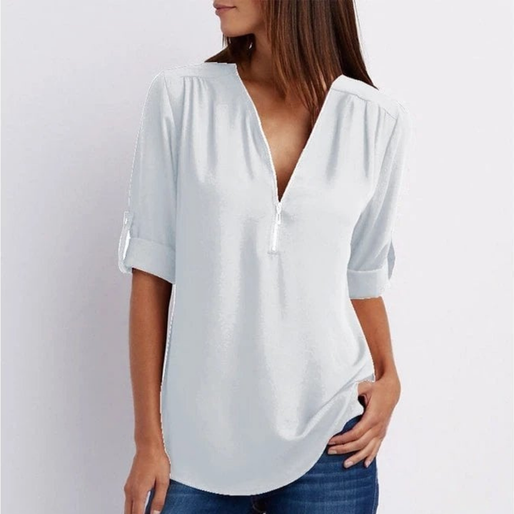 Comfortable women's relaxed-fit V-neck blouse with roll-up sleeves for casual chic or smart casual looks.