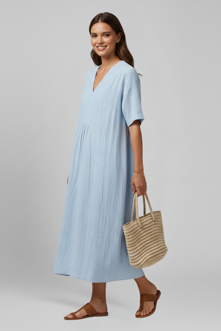 Summer style women's dress: V-neck, ruffled short sleeves, knee-length, light textured fabric.