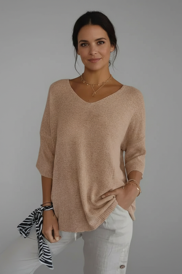 Stylish V-neck elbow sleeve women's top. A comfortable, relaxed fit pullover for casual elegance.