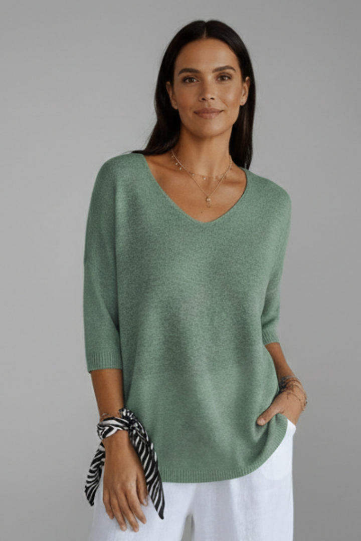 Casual women's pullover V-neck top with elbow sleeves. Comfortable & versatile for effortless daily wear.