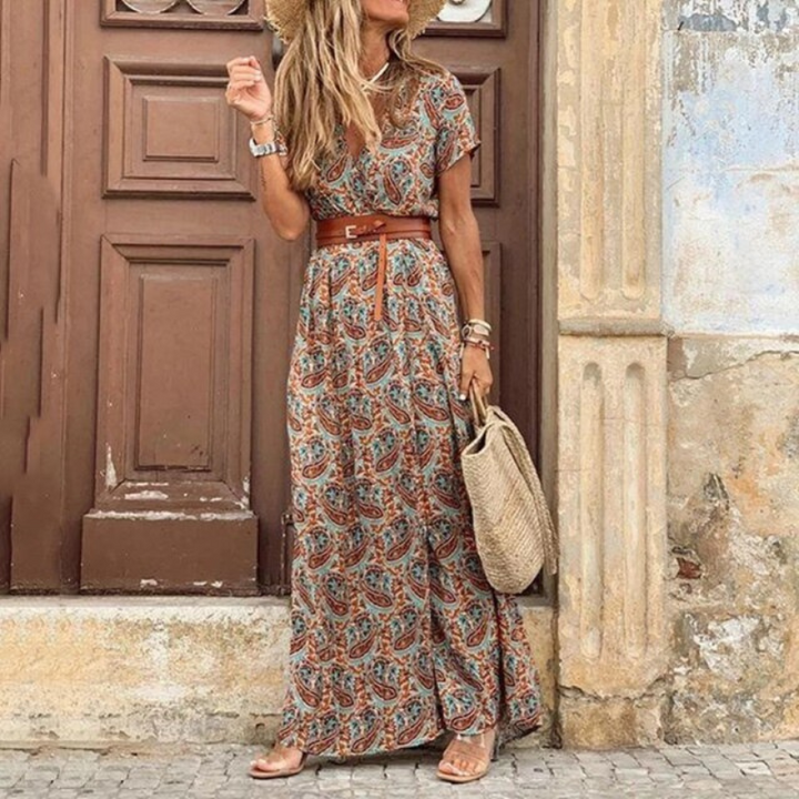 Women's V-neck floral print maxi dress featuring a chic tie waist, ideal for a beach vacation or elegant summer look.