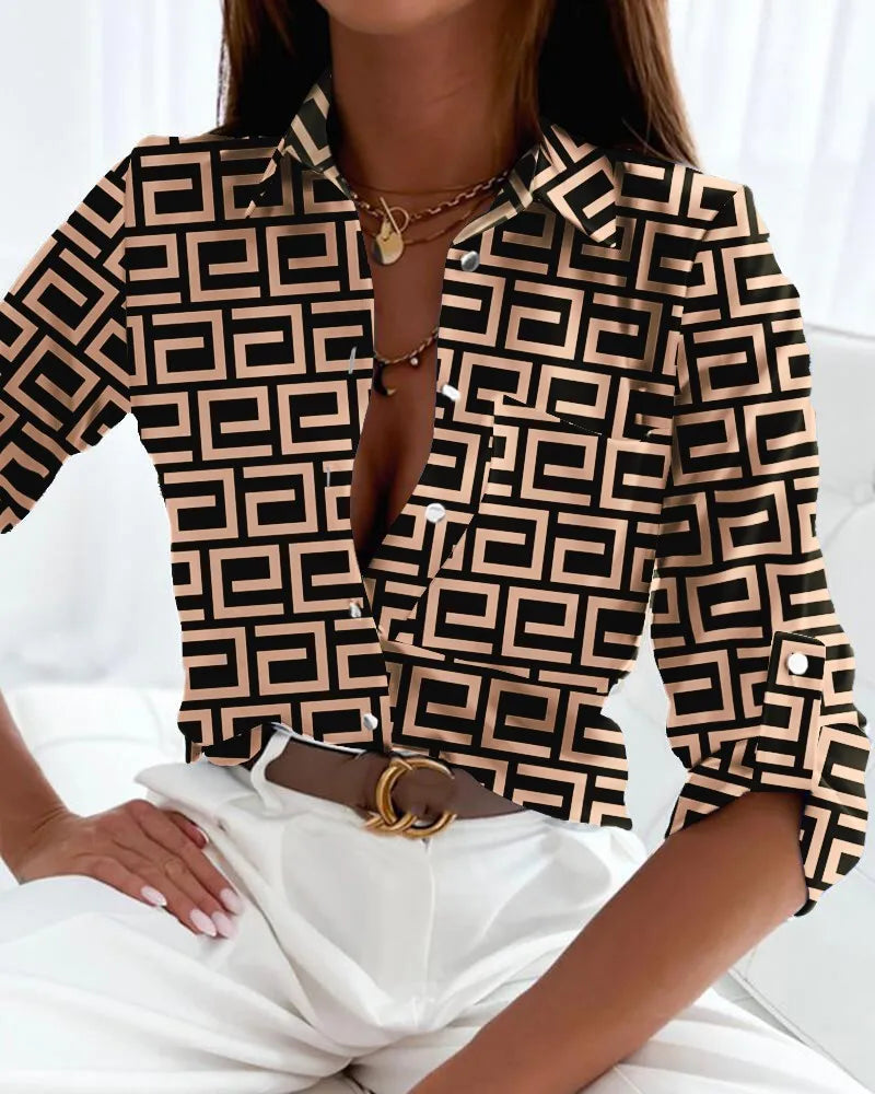 Elegant women's graphic V-neck long sleeve blouse, collared and buttoned, ideal for stylish work wear or casual chic.