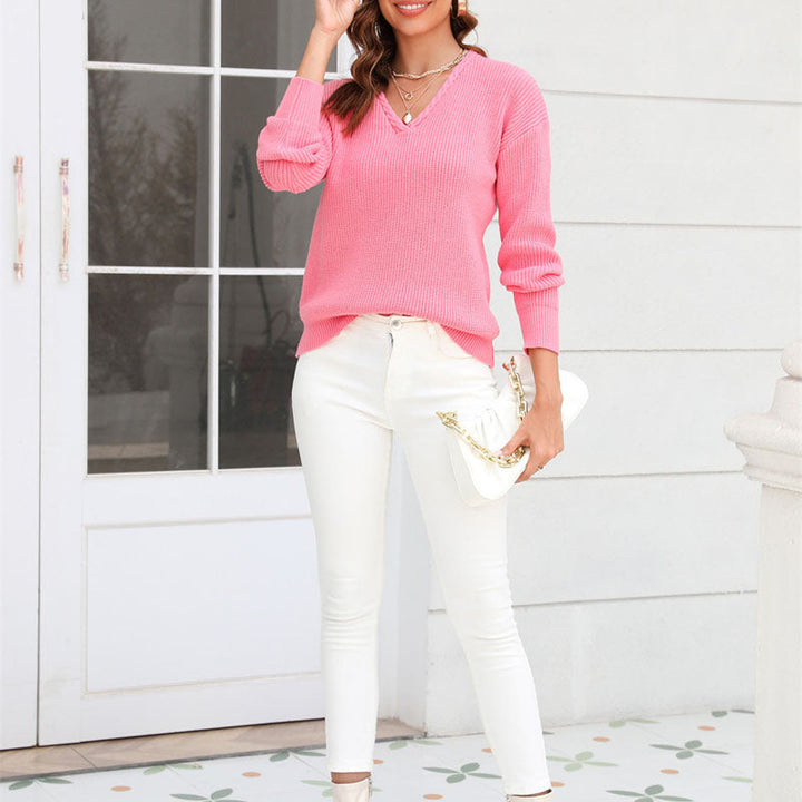Relaxed fit women's V-neck sweater. Casual knit top, perfect for comfortable lounging or autumn outings.