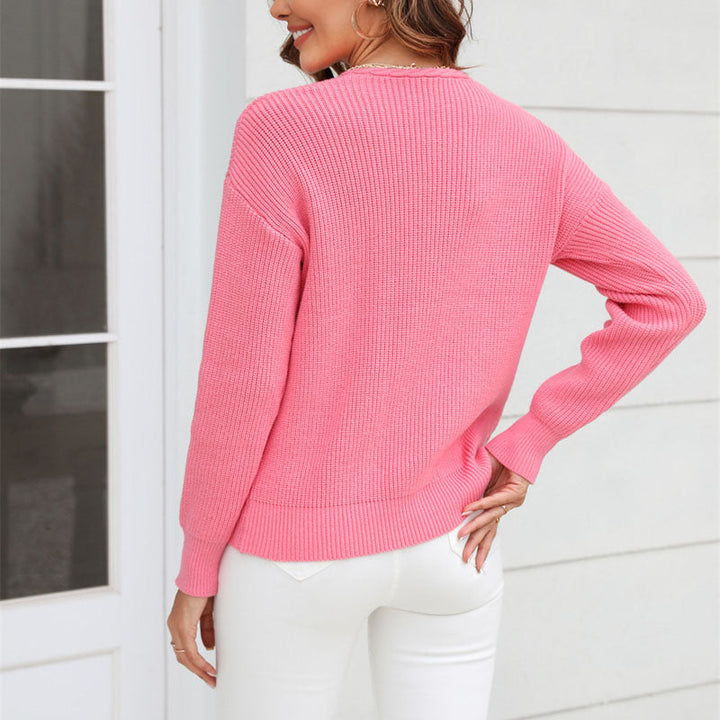 Textured knit V-neck sweater for women. Luxurious loose fit top, perfect for autumn and winter.