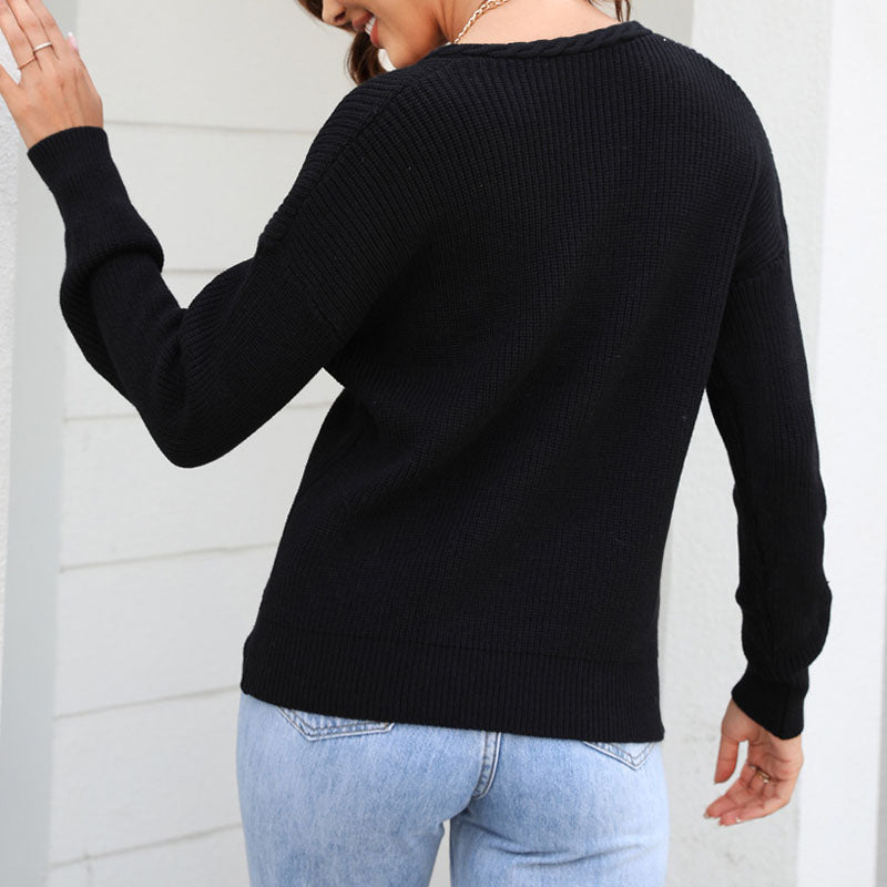 High-quality women's V-neck loose fit sweater. Durable long sleeve knit top for lasting style.