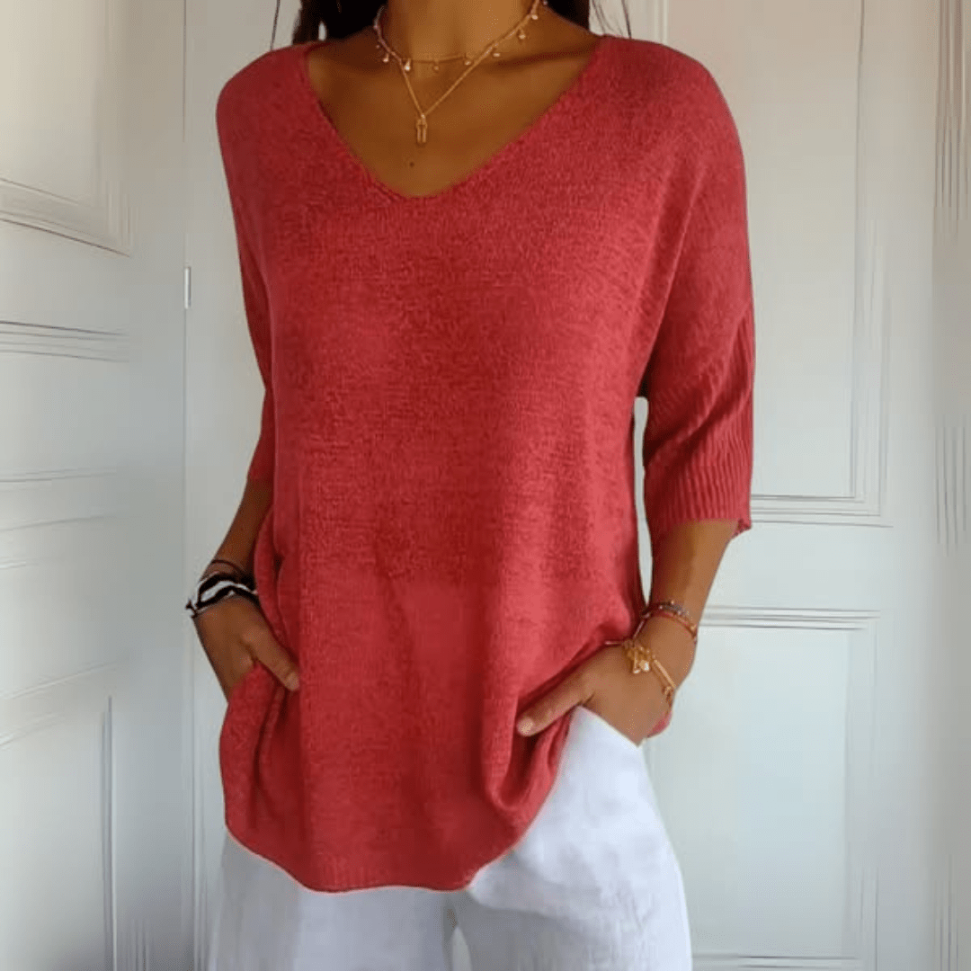 Women's V-neck loose fit sweater, three-quarter sleeve. Effortless casual pullover for everyday style.