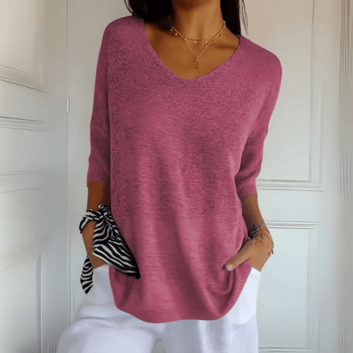 Women's stylish loose V-neck sweater, three-quarter sleeve pullover for comfortable daily wear.