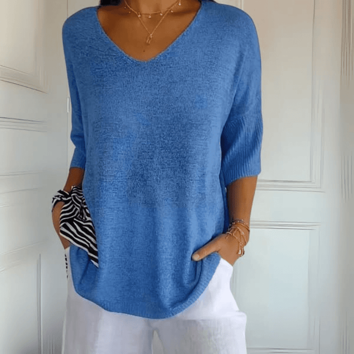 Everyday women's V-neck loose sweater, three-quarter sleeves. Comfortable pullover for stylish casual wear.