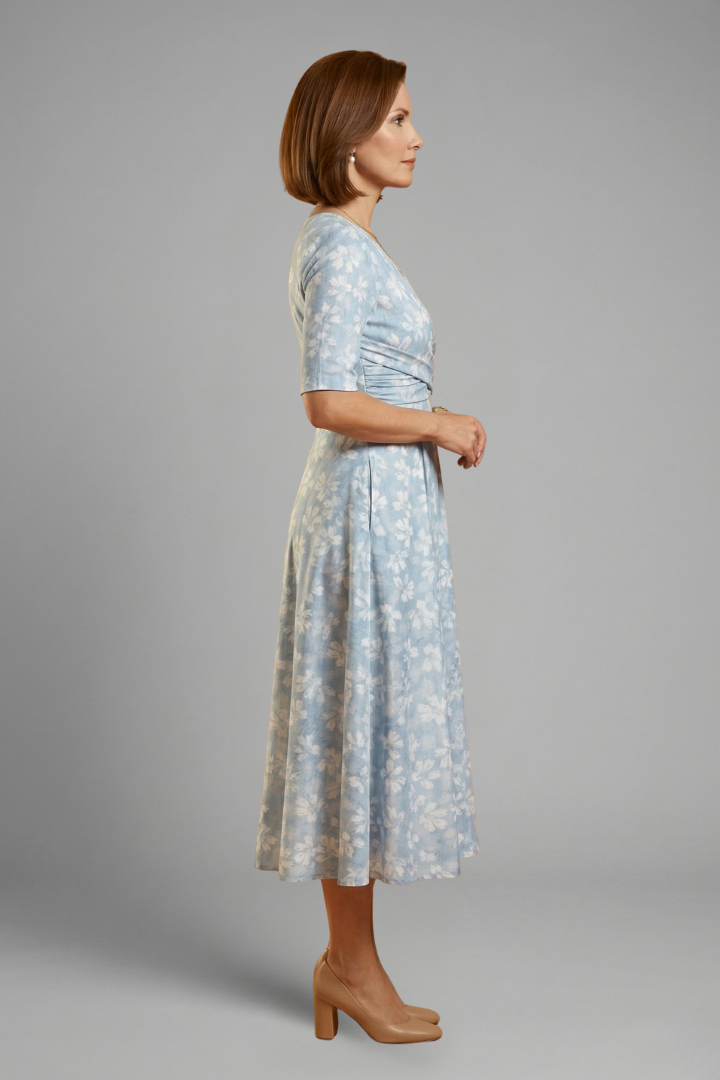 Comfortable V-neck midi dress for women. Short sleeve summer style with handy side pockets for everyday wear.